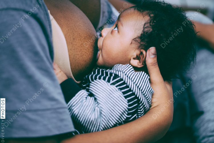 Close up of mother breastfeeding baby
