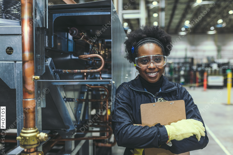Portrait of smiling woman in factory