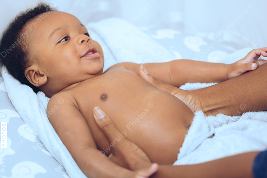 Baby lying on blue towel