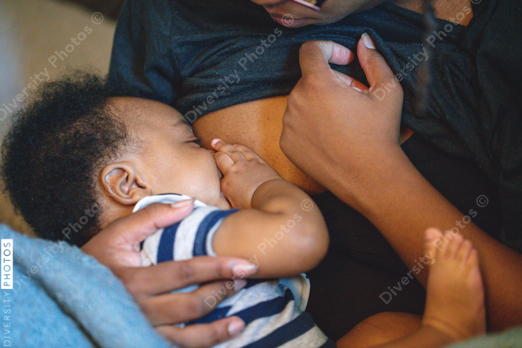 Midsection of mother breastfeeding baby son