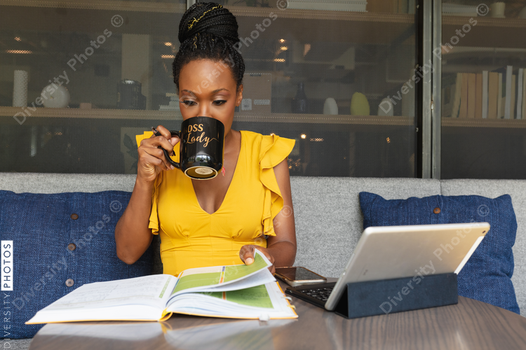 Businesswoman drinking out of boss lady mug