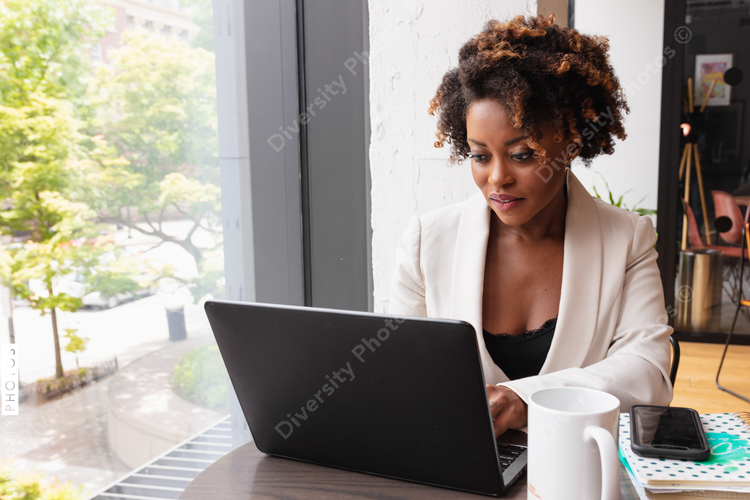 Businesswoman works on laptop