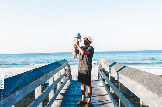 Black father and son on boardwalk