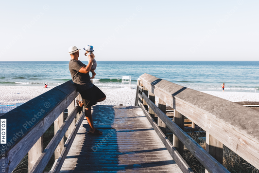 Black father and son on boardwalk