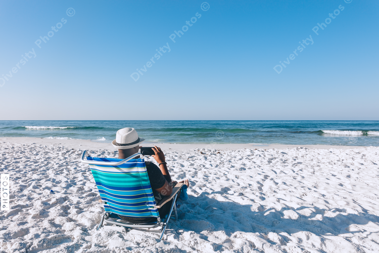 Black man relaxing on the beach