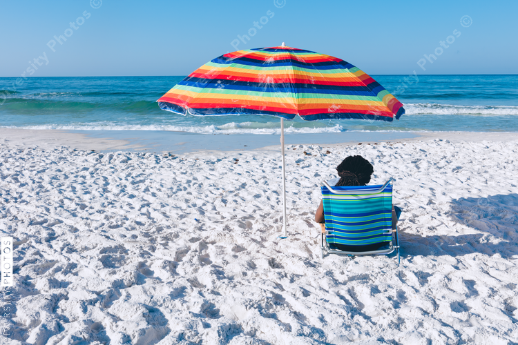 Black woman relaxing on the beach