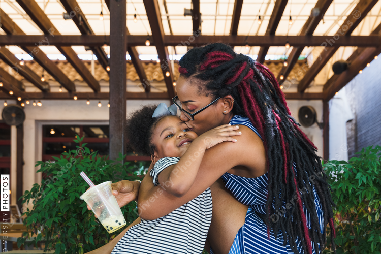 Mom hugging daughter