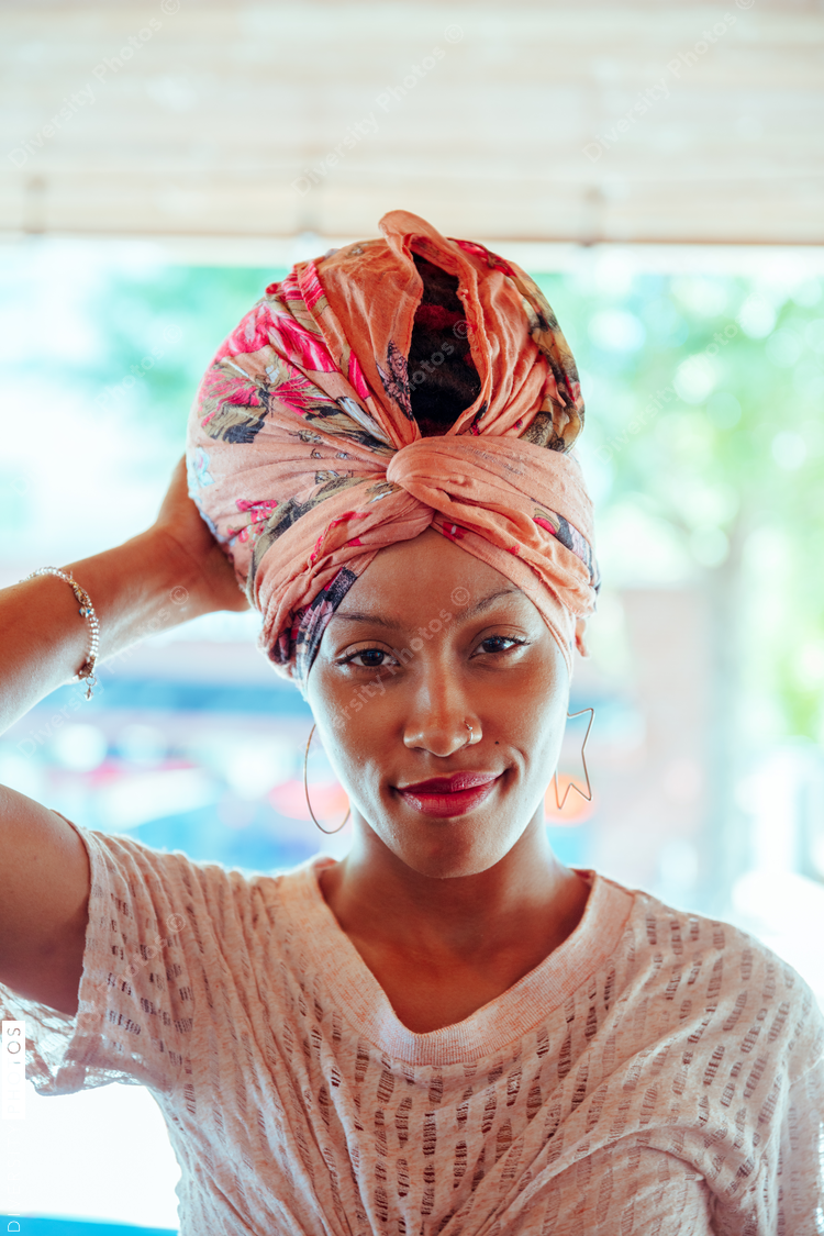 Portrait of woman wearing pink headwrap