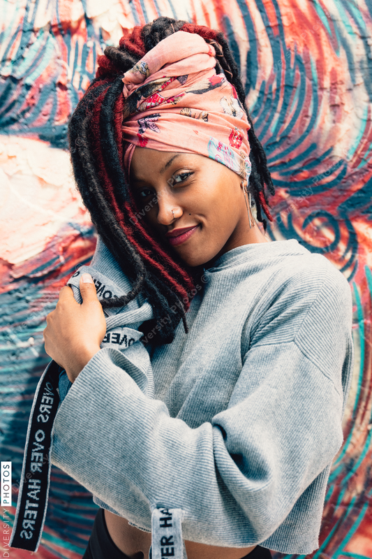 Young woman with head wrap and dreadlocks