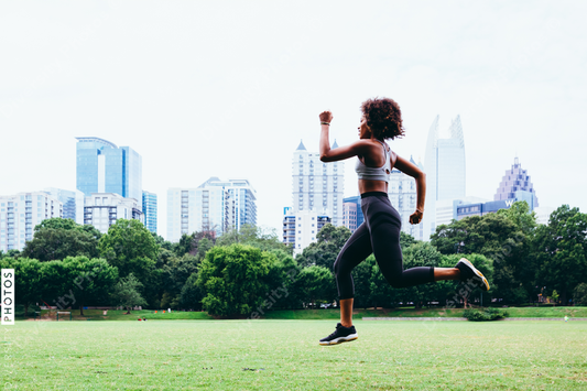 Young woman exercising in city park