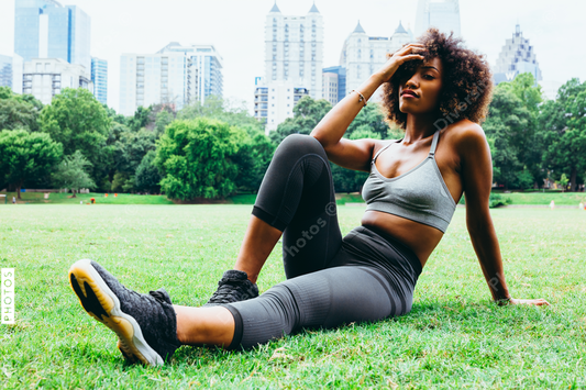 Young woman exercising in city park