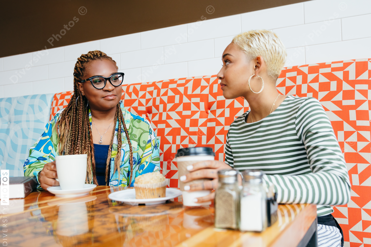 Two people talking in the cafe