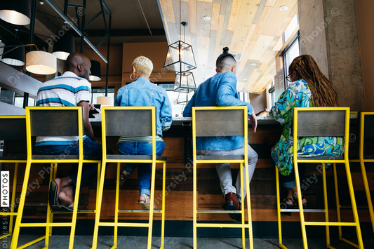 Back view of people sitting in cafe