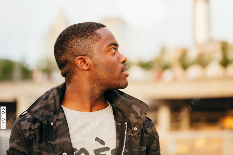 Man in jacket looking aside