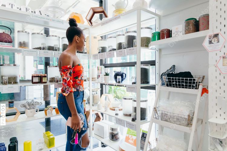Woman looking at different options in shop