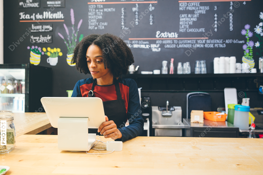 Barista looking at monitor