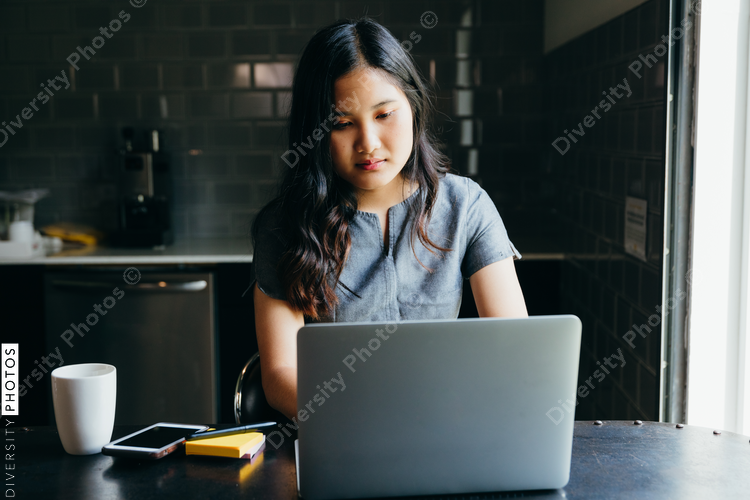 Close up of woman working on laptop