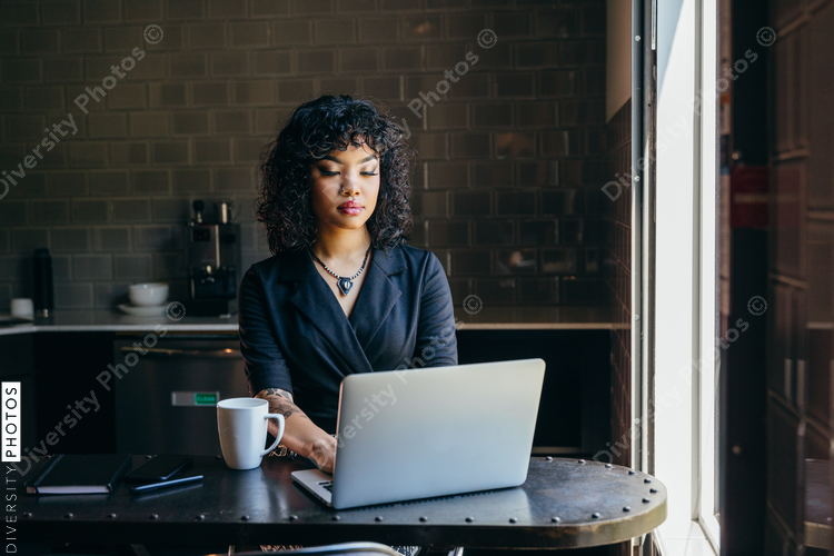 Woman working on laptop in office