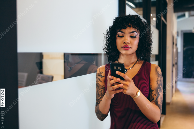Close up view of young businesswoman with mobile phone