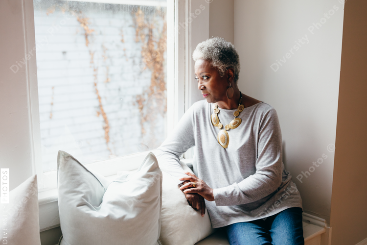 Senior woman sitting near window