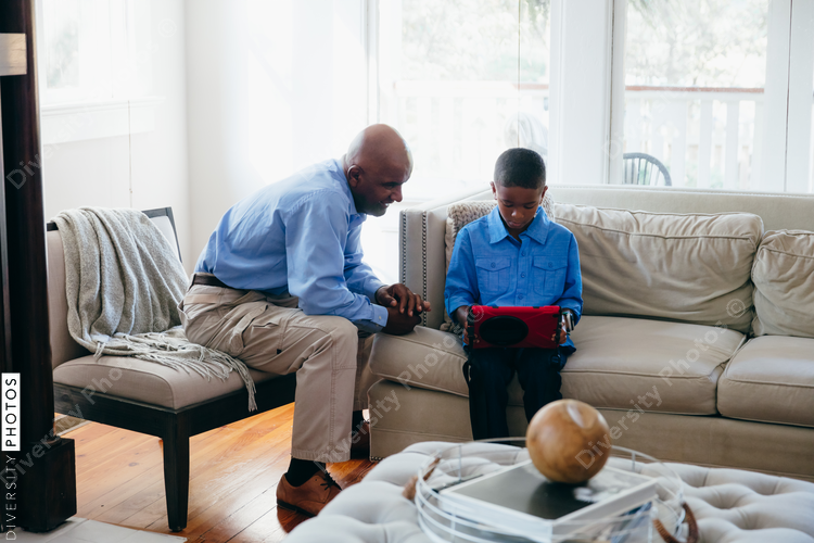 Grandfather and grandson looking at tablet