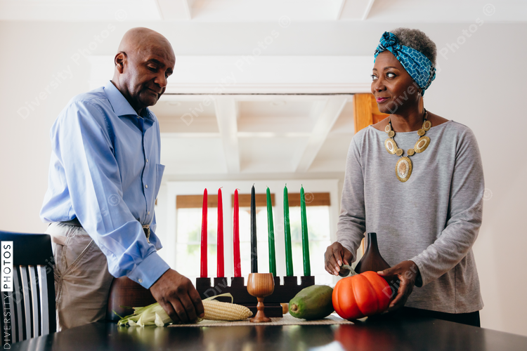 Grandparents arranging Kwanzaa set