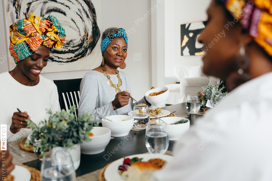 Women smiling while eating dinner