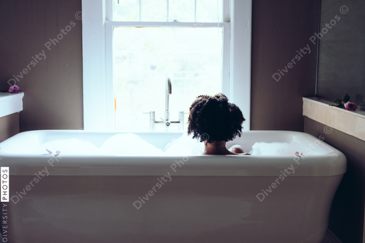 Back view of woman in bathtub