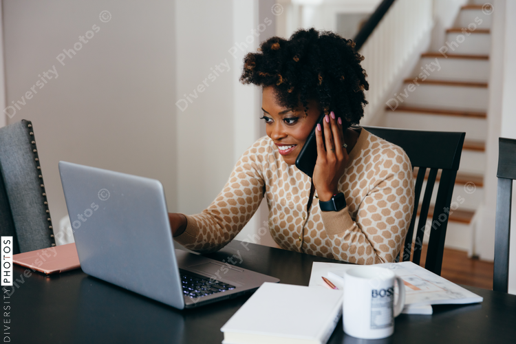 Businesswoman talking on phone and smiling