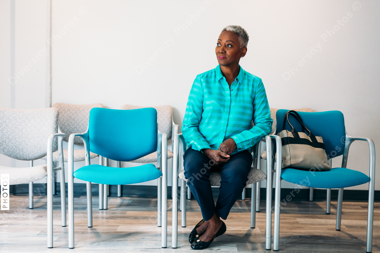 Mature woman waiting in doctor's office lobby
