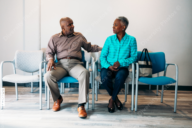 Mature couple waiting in medical office