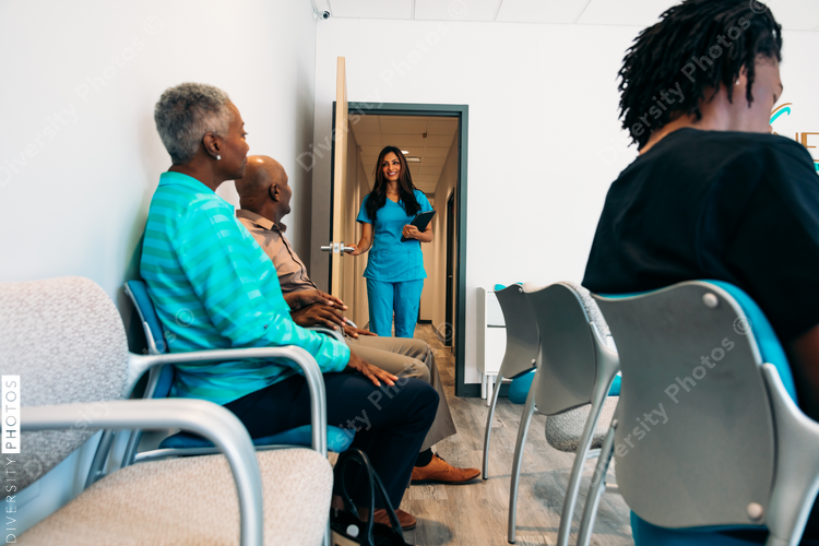 Nurse calling patients to be seen by doctor