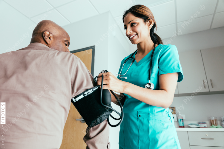 Doctor checking heart rate and blood pressure