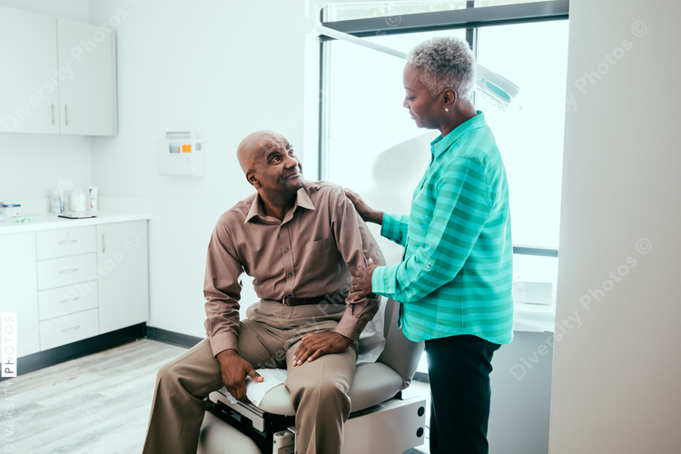 Mature couple waiting in exam room
