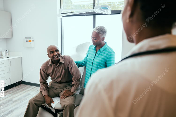 Mature patient smiling at doctor