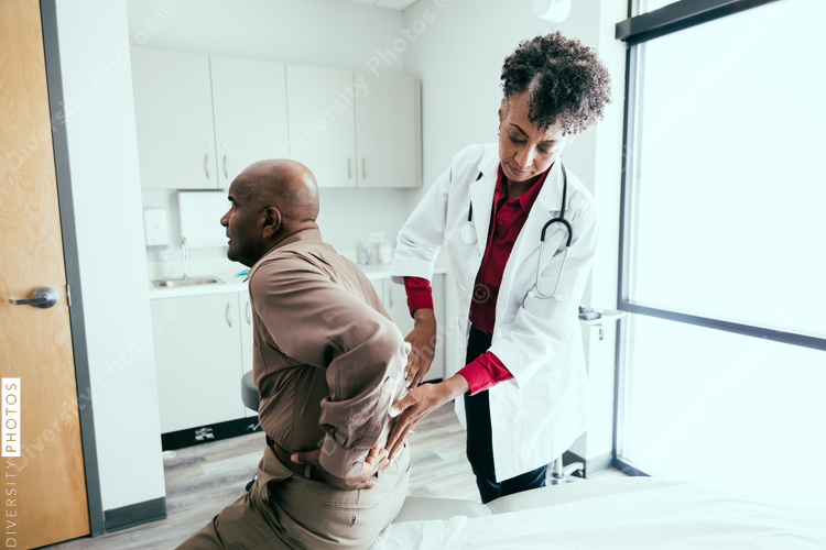 Doctor checks for pain and swelling