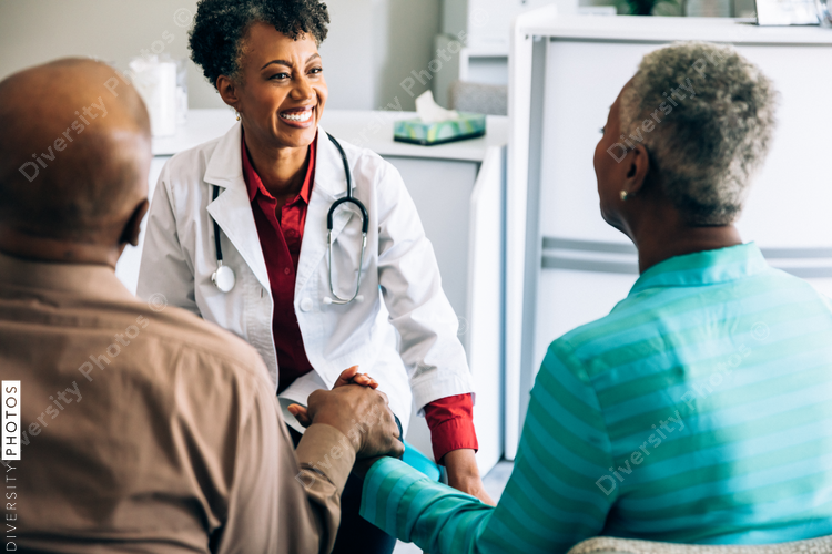 Doctor consulting mature couple