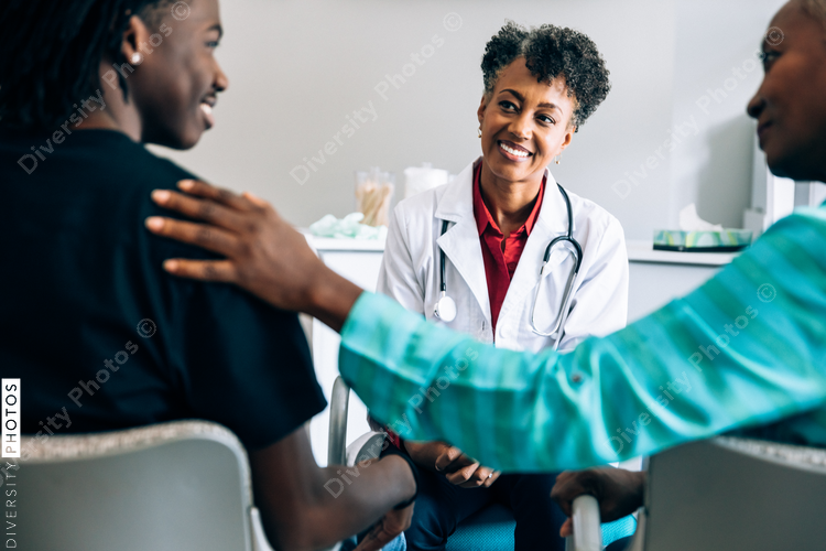 Doctor consulting young patient and grandmother