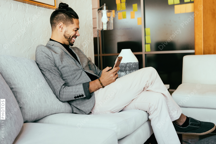 Man sitting on couch at office