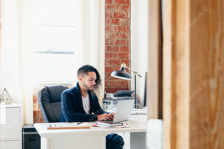 Man sitting at desk working in office
