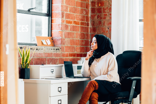 Young Muslim woman working In modern office