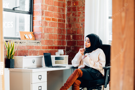 Young Muslim woman working In modern office