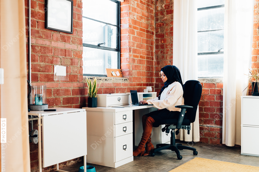 Young Muslim woman working In modern office