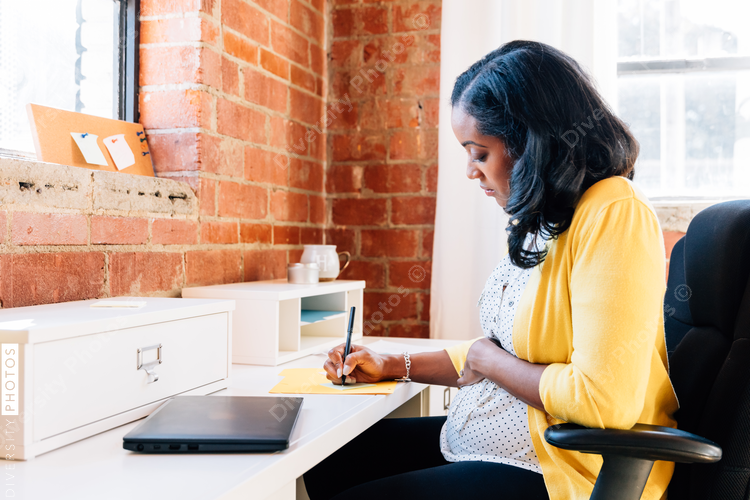 Pregnant businesswoman in modern office