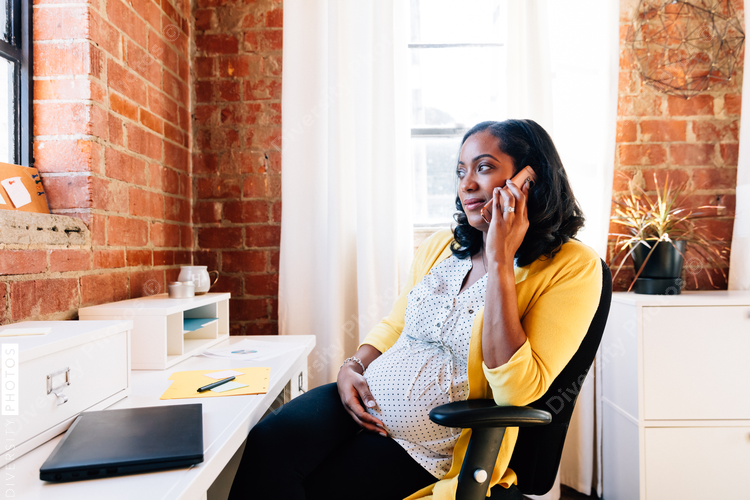 Pregnant businesswoman in modern office