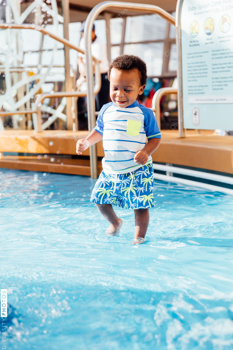 Young toddler playing in pool