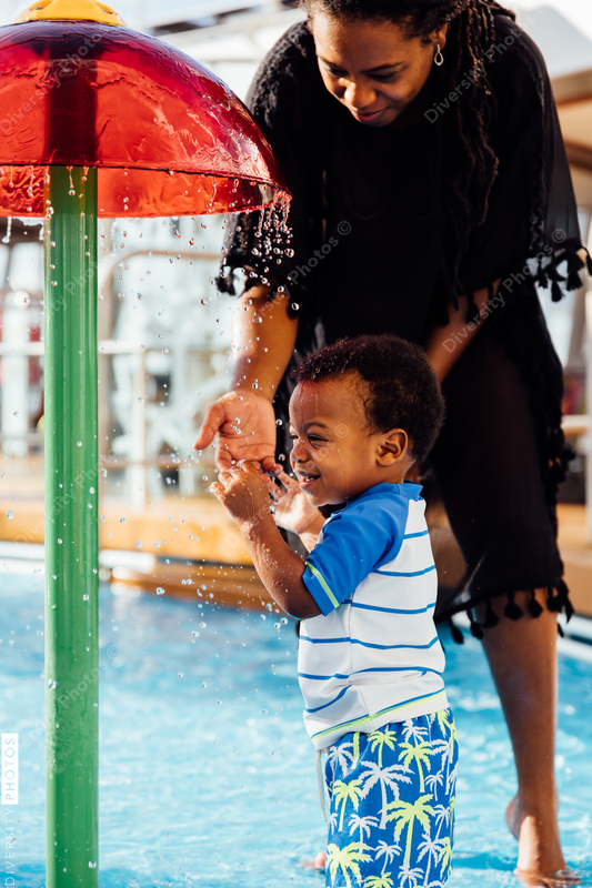 Young toddler playing in pool