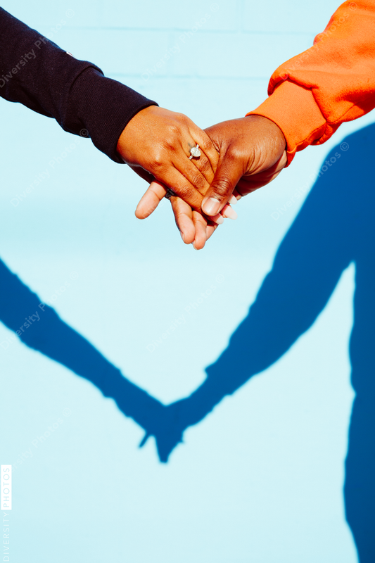 Beautiful young couple holding hands