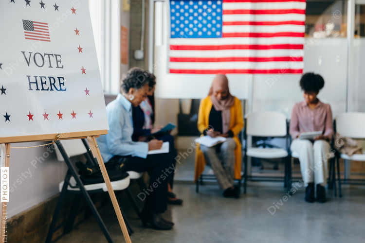 Diverse Voters Filling Out Registration Forms