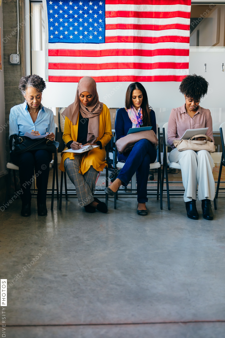Diverse Voters Filling Out Registration Forms